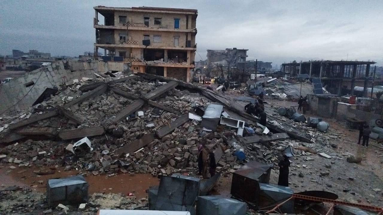 A shell of a building among rubble after the earthquake in Turkey 